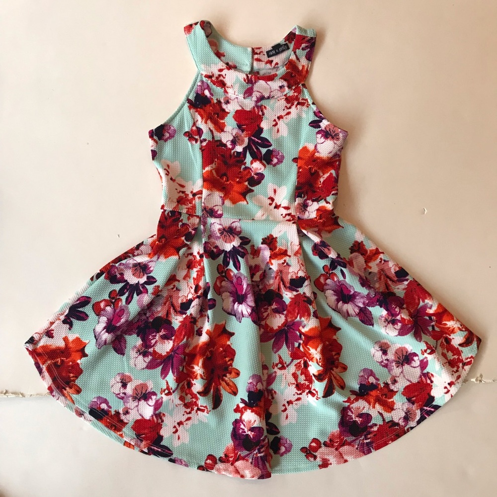 This clothing piece is a floral girls/kids dress.